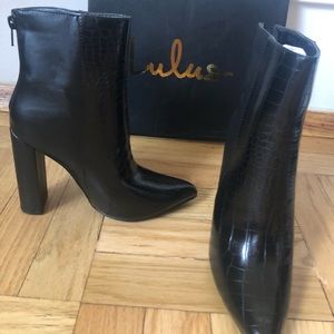 Black heeled leather booties